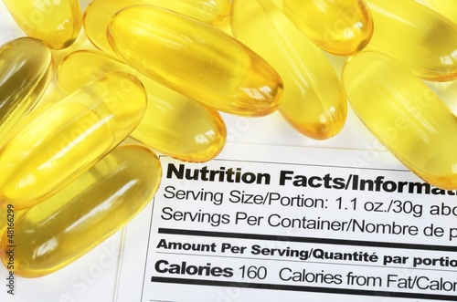 Photo: Nutrition label with fish oil pills concept healthy eating Nutrition label with fish oil pills concept healthy eating
