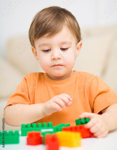Photo: Boy is playing with building blocks Boy is playing with building blocks