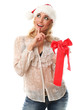 Young woman in red christmas cap holding gifts