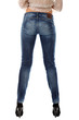 Closeup of beautiful legs in jeans on black heels