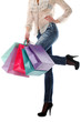 Shopping bags near legs in jeans