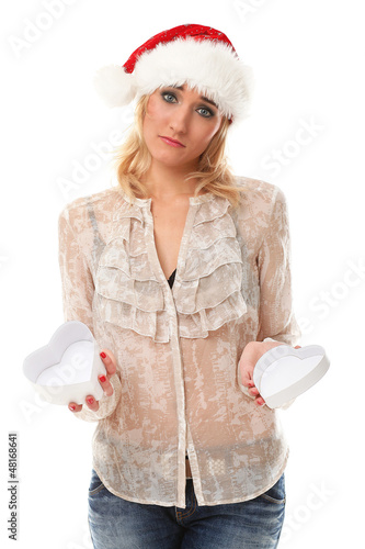 Photo: Unhappy young woman in christmas cap Unhappy young woman in christmas cap