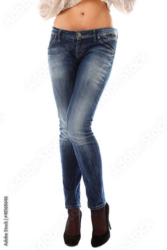 Photo: Closeup of beautiful legs in jeans Closeup of beautiful legs in jeans