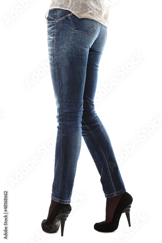 Photo: Closeup of beautiful legs in jeans Closeup of beautiful legs in jeans