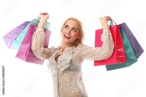 Photo: Young beautiful caucasian woman holds bags Young beautiful caucasian woman holds bags