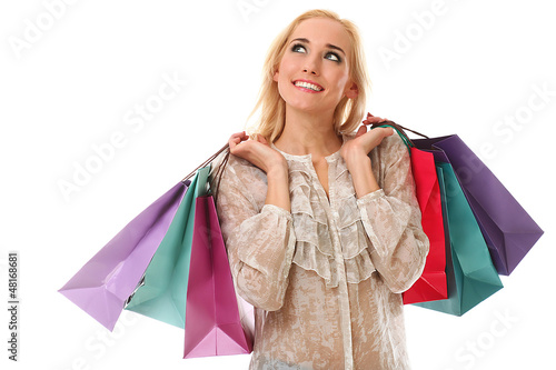 Photo: Young beautiful woman holds shopping bags Young beautiful woman holds shopping bags