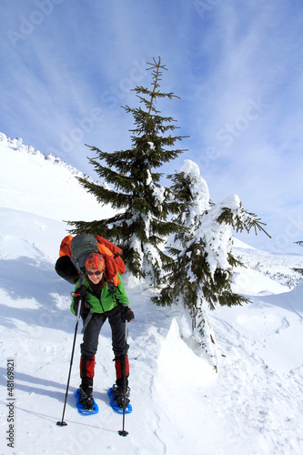 Photo: Winter hiking in snowshoes. Winter hiking in snowshoes.