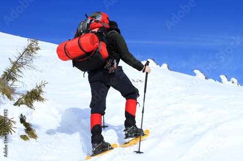 Photo: Winter hiking in snowshoes. Winter hiking in snowshoes.