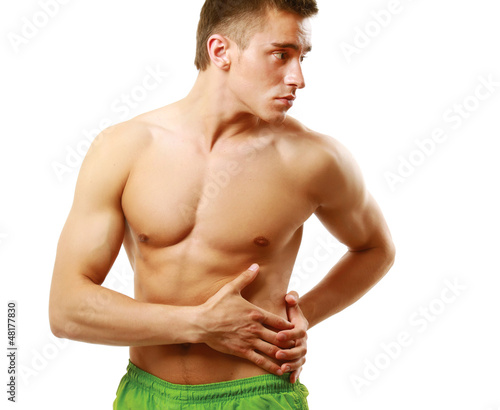 Photo: Strong man with a helathy body isolated over white background Strong man with a helathy body isolated over white background