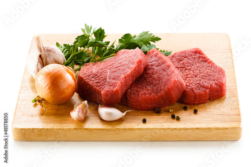 Photo: Raw beef on cutting board Raw beef on cutting board