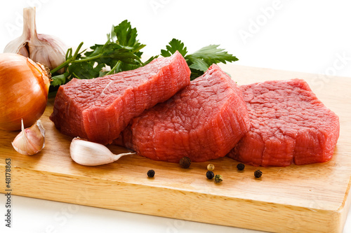 Photo: Raw beef on cutting board Raw beef on cutting board