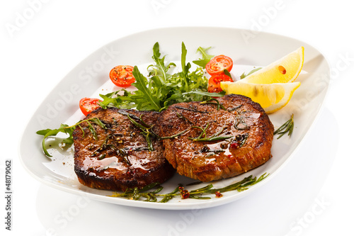 Photo: Grilled steaks and vegetables Grilled steaks and vegetables