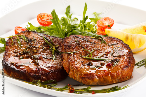 Photo: Grilled steaks and vegetables Grilled steaks and vegetables