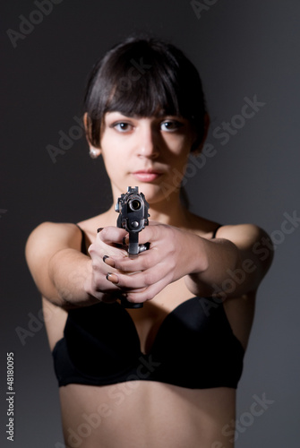 Photo: Beautiful sexual girl brunette with gun Beautiful sexual girl brunette with gun