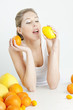 portrait of young woman with citrus fruit