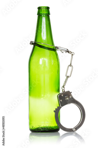 Photo: Bottle and handcuffs Bottle and handcuffs