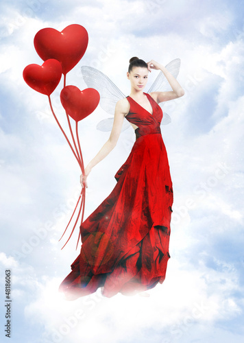Photo: Atractive love fairy in clouds Atractive love fairy in clouds