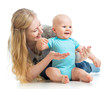 loving mother holding baby boy isolated on white
