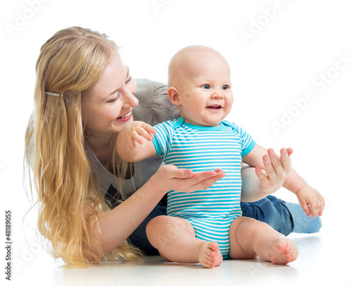 Photo: loving mother holding baby boy isolated on white loving mother holding baby boy isolated on white