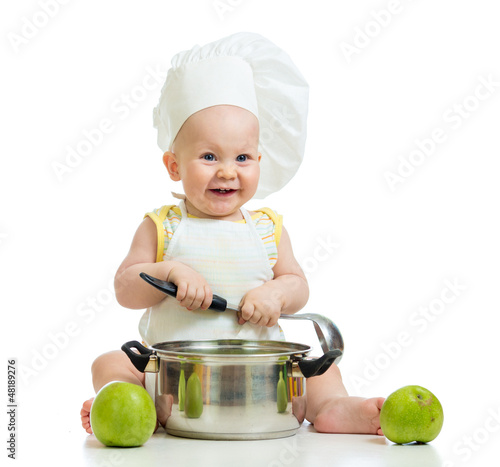 Photo: funny adorable baby with green apples isolated on white backgrou funny adorable baby with green apples isolated on white backgrou