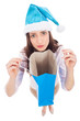Foto: Woman in Santa hat holding empty bag Woman in Santa hat holding empty bag