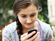 Girl playing on mobile phone