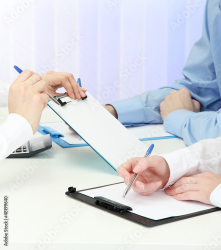 Photo: close up of business people hands during teamwork close up of business people hands during teamwork