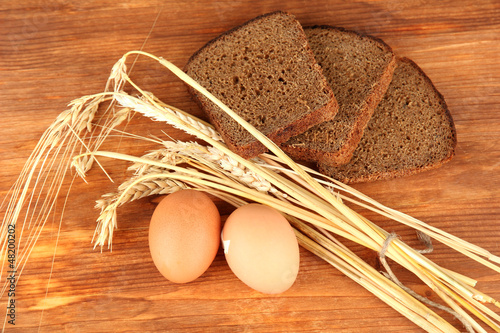 Photo: Boiled eggs on wooden background Boiled eggs on wooden background