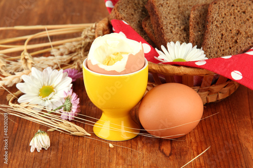 Photo: Boiled eggs on wooden background Boiled eggs on wooden background