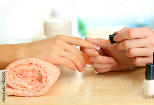 Photo: Manicure process in beauty salon, close up Manicure process in beauty salon, close up