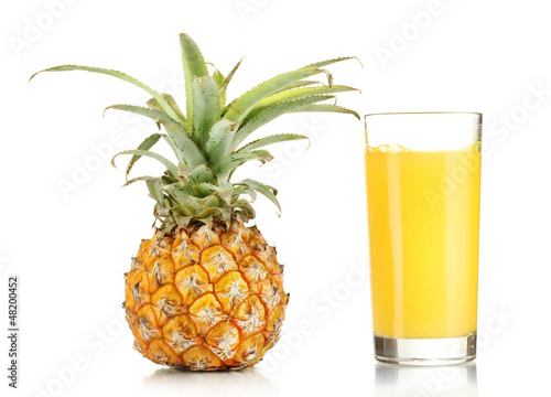 Photo: Ripe pineapple and juice glass isolated on white Ripe pineapple and juice glass isolated on white
