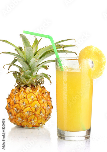 Photo: Ripe pineapple and juice glass isolated on white Ripe pineapple and juice glass isolated on white