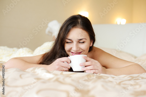 Photo: brunette enjoying coffee brunette enjoying coffee