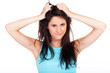 frustrated young woman pulling her hair