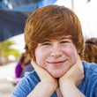outdoor portrait of relaxed cute young boy