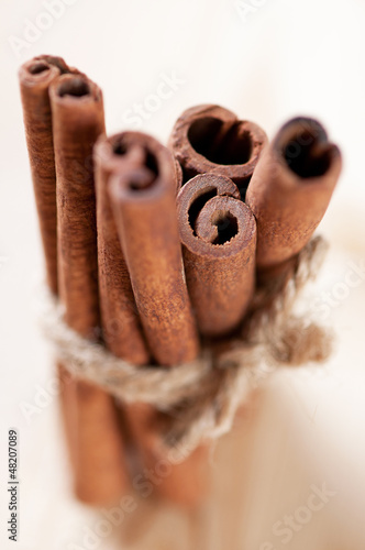 Photo: Bundle of cinnamon sticks, shallow depth of field Bundle of cinnamon sticks, shallow depth of field