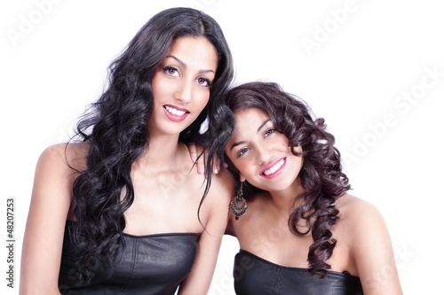 Photo: Two happy smiling girl friends Two happy smiling girl friends