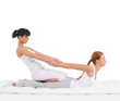 A young redhead woman on a Thai massage procedure
