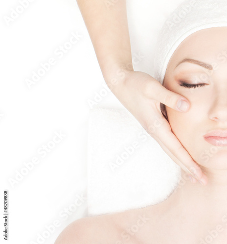 Photo: Portrait of a young woman in a towel on a spa procedure Portrait of a young woman in a towel on a spa procedure