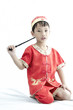 China boy in traditional Chinese red Tang suit greeting