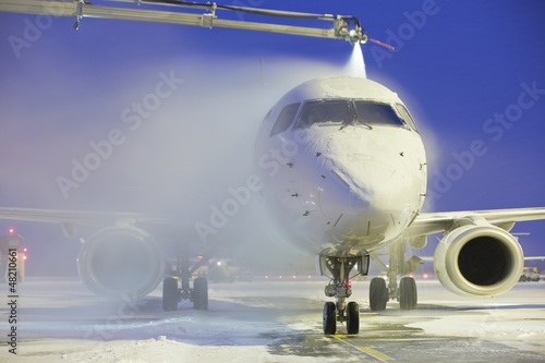 Photo: De-icing of the airplane De-icing of the airplane