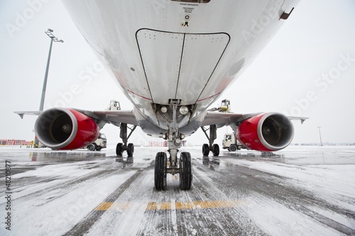 Photo: Undercarriage of the airplane in winter Undercarriage of the airplane in winter
