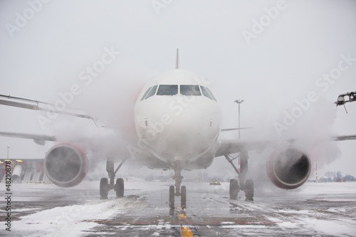 Photo: De-icing of the airplane De-icing of the airplane
