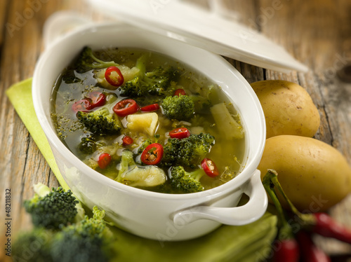 Photo: soup with broccoli and potatoes, selective focus soup with broccoli and potatoes, selective focus