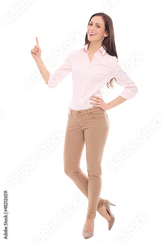 Photo: Young woman pointing up Young woman pointing up