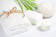 Towel and sponge spa bath concept on white background
