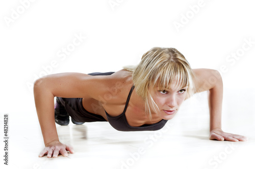 Photo: strong woman doing push-up strong woman doing push-up