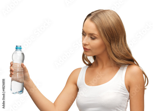 Photo: young beautiful woman with bottle of water young beautiful woman with bottle of water