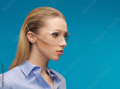 Photo: businesswoman in protective glasses businesswoman in protective glasses