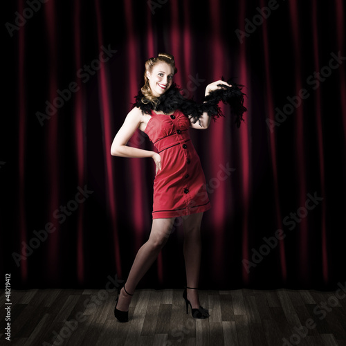 Photo: Theater Performer In Front Of Red Stage Curtains Theater Performer In Front Of Red Stage Curtains